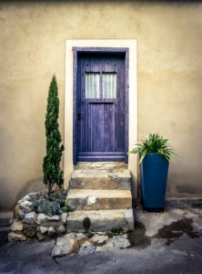 Colored wooden door and stairs in Gruissan Colored wooden door and stairs in Gruissan